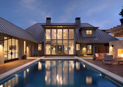 House with metal roof Overlooking a pool